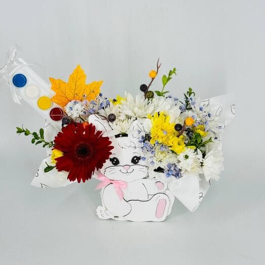 Autumn bouquet of flowers with paints in a kashpo bunny