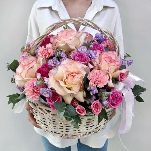 Radiance of velvet of French roses in the basket
