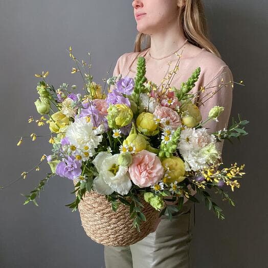Blooming basket of delicate seasonal colors