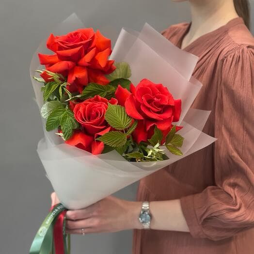 Bouquet of flowers with red French roses with raspberries