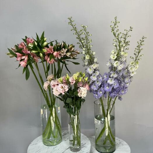 A set of flowers for a house with vases