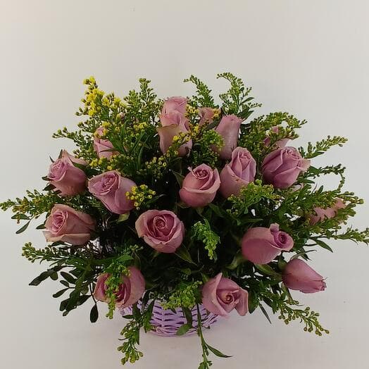 A composition of 27 lilac roses Samantha S Bridal in a lilac basket