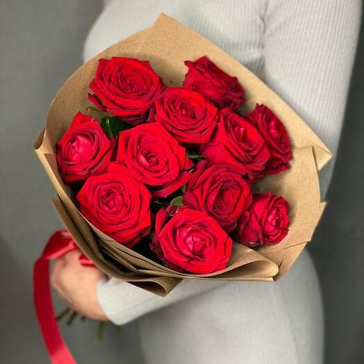 11 red aromatic roses in crafting packaging