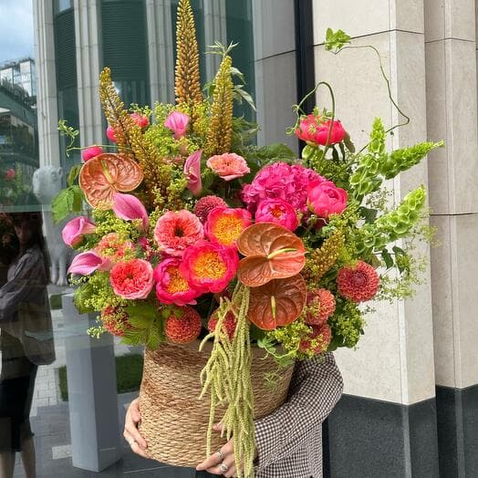 Author's composition. Coral peonies, anthuriums, exotic erimuruses and dahlias