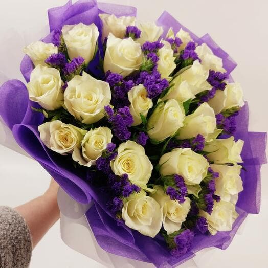Bouquet of 25 white roses athena with static twigs in white-violet packaging