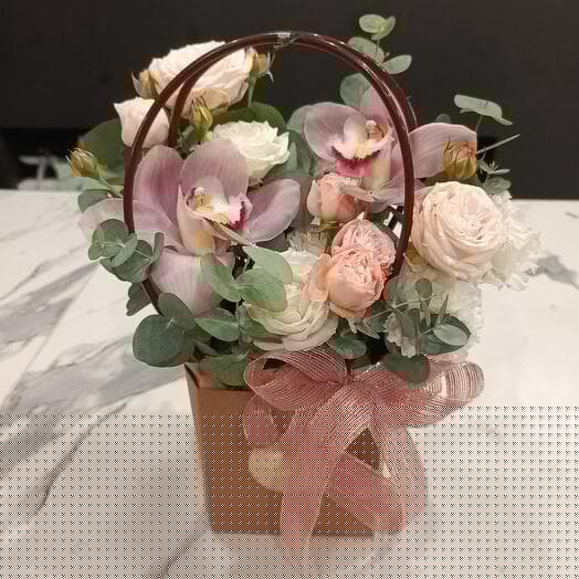 Flowers in a box with an orchid