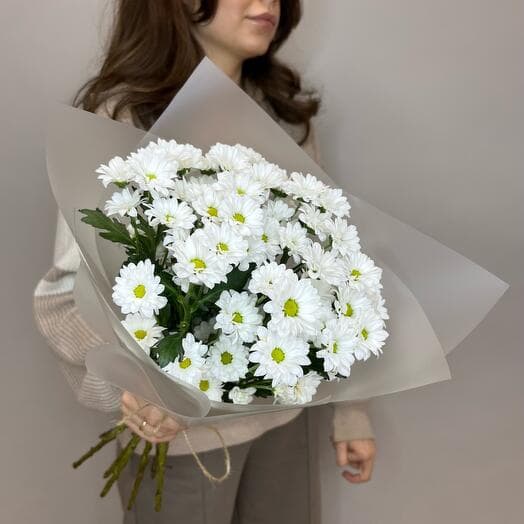 Bouquet of small white chrysanthemums in packaging