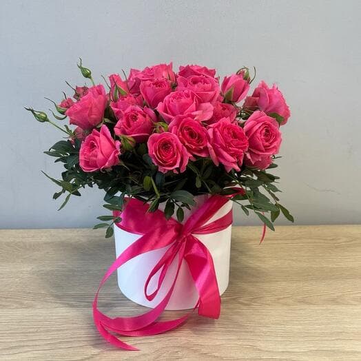 Box with bright bush roses