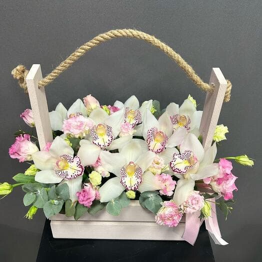 Mix from white orchids and east in a wooden box