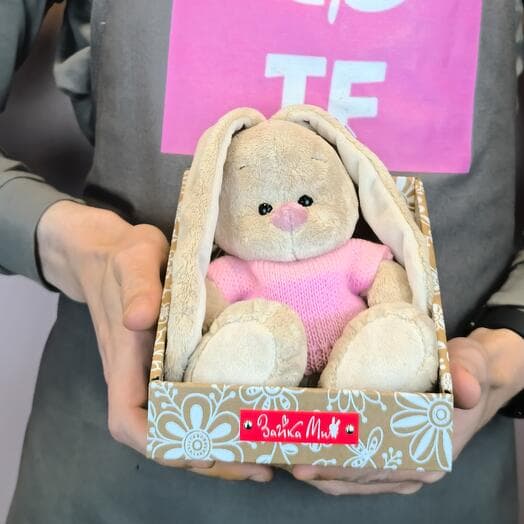 Bunny mi in a pale pink sweater