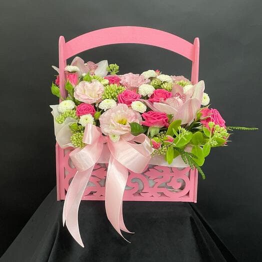 Orchids, roses and lysianthus in a pink box. (Flowers for women, girls, mothers, wives, teachers, colleagues.)