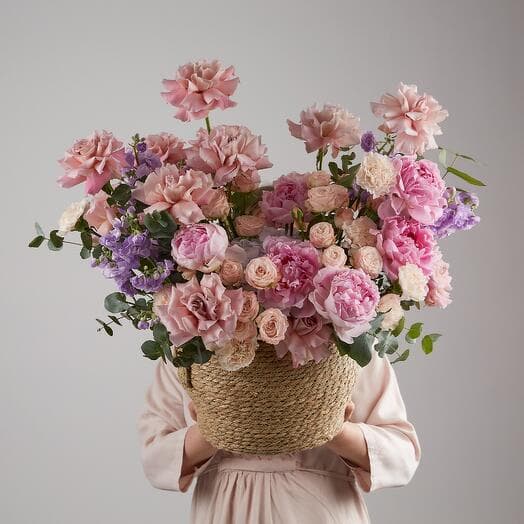 A basket with pink peonies and a fragrant mattiola. Art 725