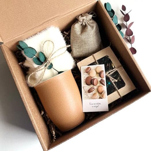 Gift set with a mug, socks, tea and sweets