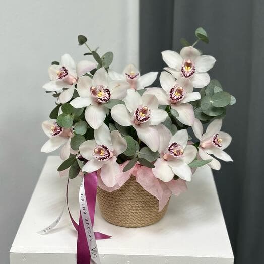 White orchids in a jute basket