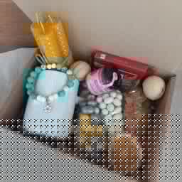 Gift set with natural bracelets, nuts, honey, chocolate and candles0