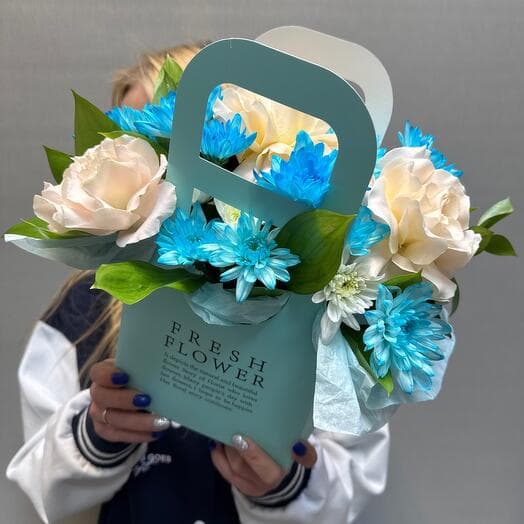 French roses with chrysanthemum in the box