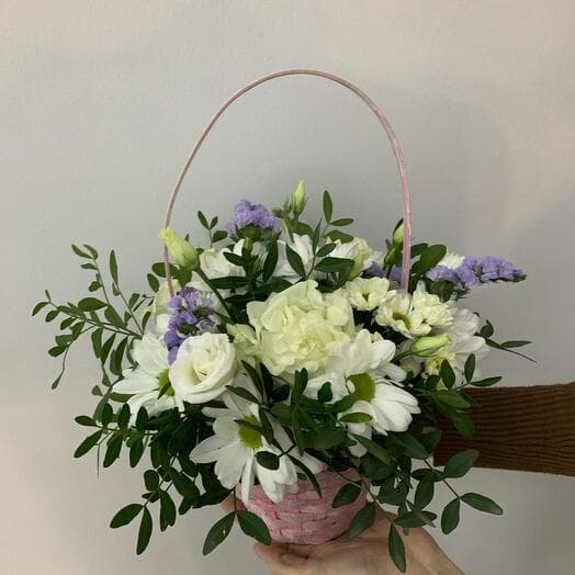 Basket with flowers with roses and chrysanthemum