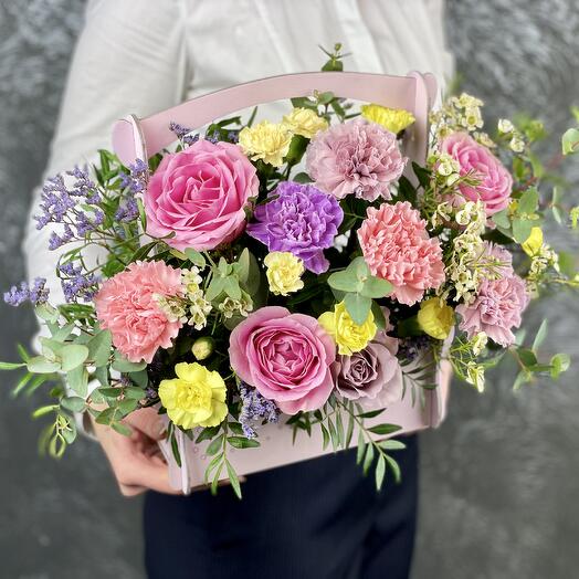 Flowers in a box of a basket of happiness