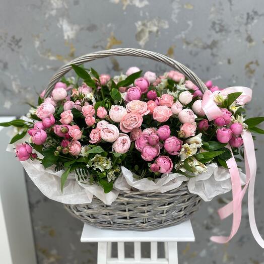 Part of the English garden, basket with bush roses and alstriently