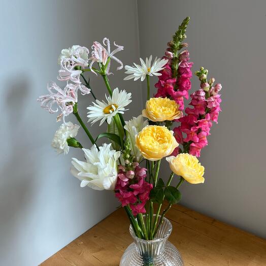 Bouquet with nerin chamomiles with pionoid roses lion's eating