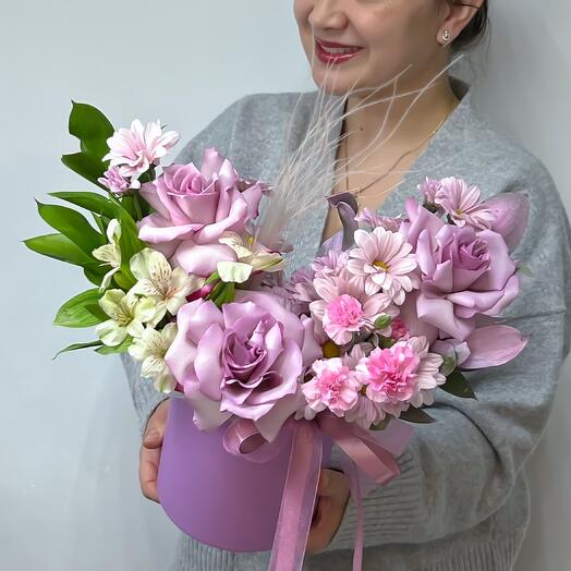 A violet bouquet of French roses, lace dianthus, bush chrysanthemum, alstromeria, stiph and russian in the box