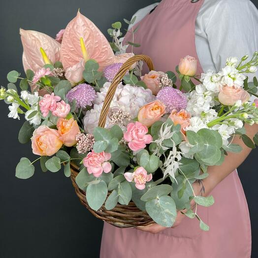 Flowers in the basket. Juliet bush roses, pink hydrangea, chrysanthemum Momoko and Anturium