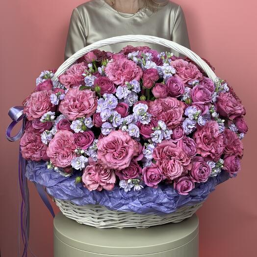 Flowers in the basket. Pionovite roses and fragrant mattiola premium