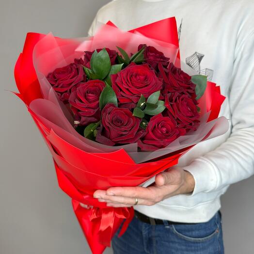 Bouquet of red roses with greens