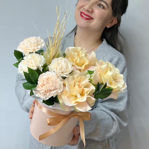 A delicate bouquet of French roses, alstromeria, lace diatus and pampas grass in a hat box