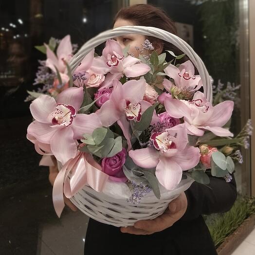 Basket with an orchid and eucalyptus