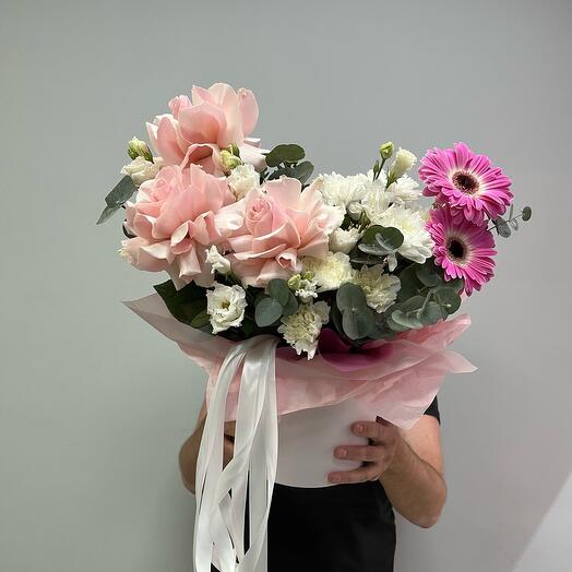 French roses with gerbera and east in a hat box