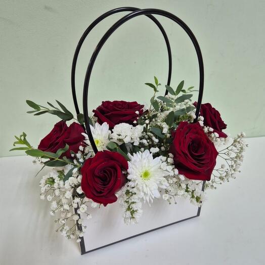 The composition "Red roses in a white bag"
