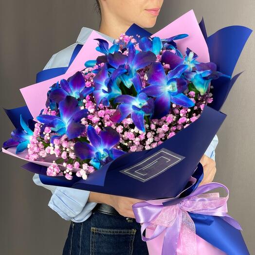 Bouquet with a bright blue orchid and gypsophila