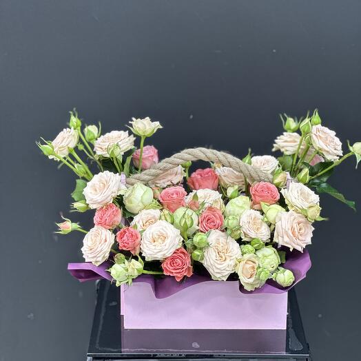 Bush pionivate roses in a box