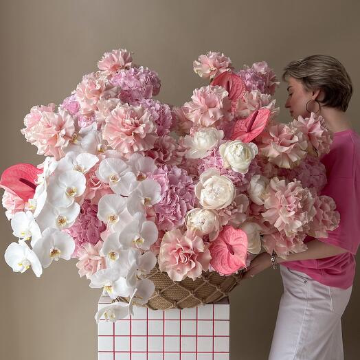 A luxurious basket with phalaenopsis, anthurium and French rose