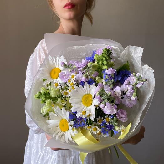 Summer bouquet of daisies, cornflowers and other meadow colors