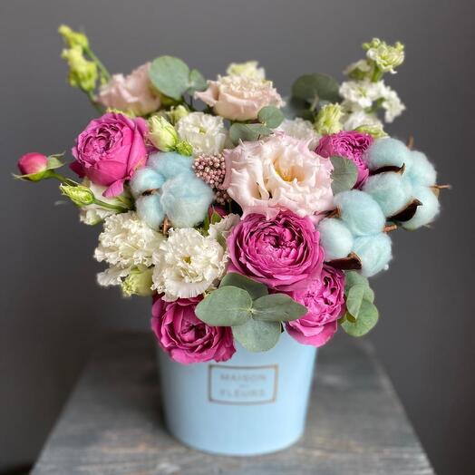 Flowers in a box with a pionoid rose