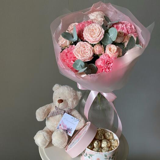 Gift set with a bear, sweets and a delicate bouquet