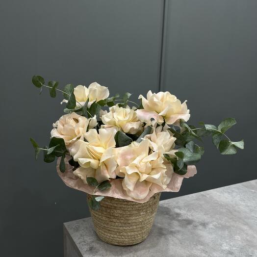 Basket with French roses and eucalyptus