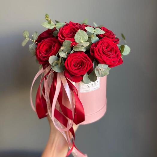 Flowers in a box of red roses and eucalyptus