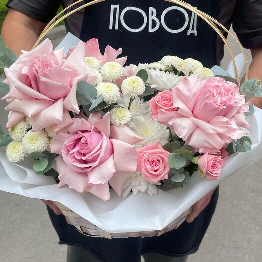 Basket with flowers with French roses, bush, eucalyptus, rose French pink bush in the basket Tender basket
