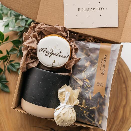 Gift set for a man, colleagues, with a mug, tea and a gingerbread