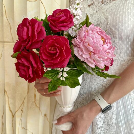 Interior bouquet of peonies and lilacs in a porcelain vase