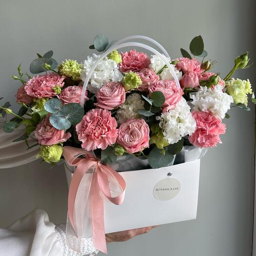 Pionovid bush roses, diatus, eucalyptus and eastoma, composition in a purse