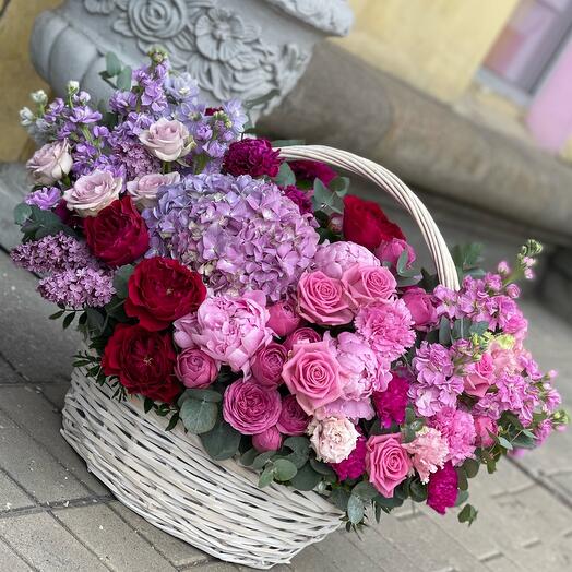 Basket with flowers (hydrangeas, roses, peonies, bush roses, etc.)