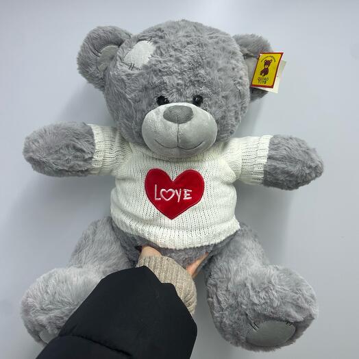 Plush bear in Love sweater