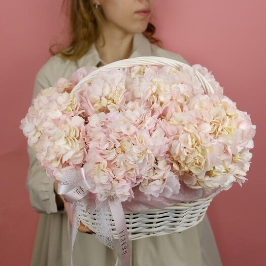 Basket with flowers. Lush composition from hydrangeas