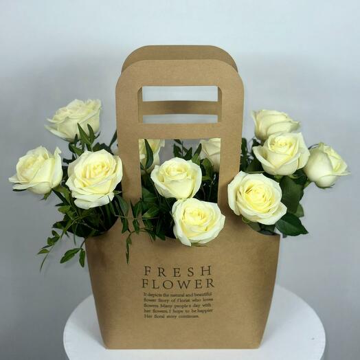 11 white roses in a purse
