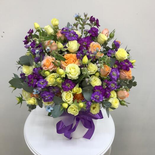 Flowers in a box with bush roses