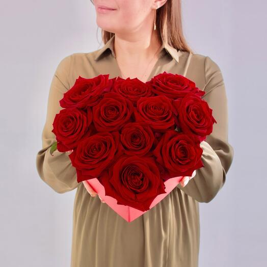 Red roses 11 pcs in a box of heart on February 14, lovers Day. Bouquet flowers of the capital